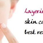 Extreme Close Up Of A Beautiful Young Woman Applying Cream To He