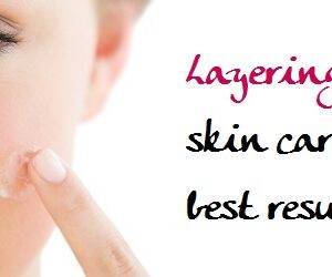 Extreme Close Up Of A Beautiful Young Woman Applying Cream To He